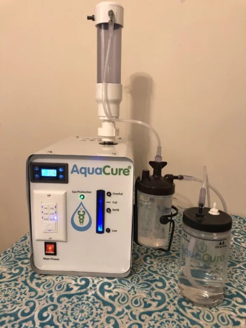AquaCure AC50 unit, standalone product shot showing the tower and base